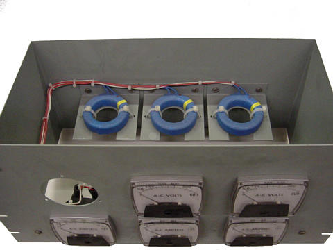 Toroidal current transformers scale high current levels down for application to 5 A full-scale AC ammeters.